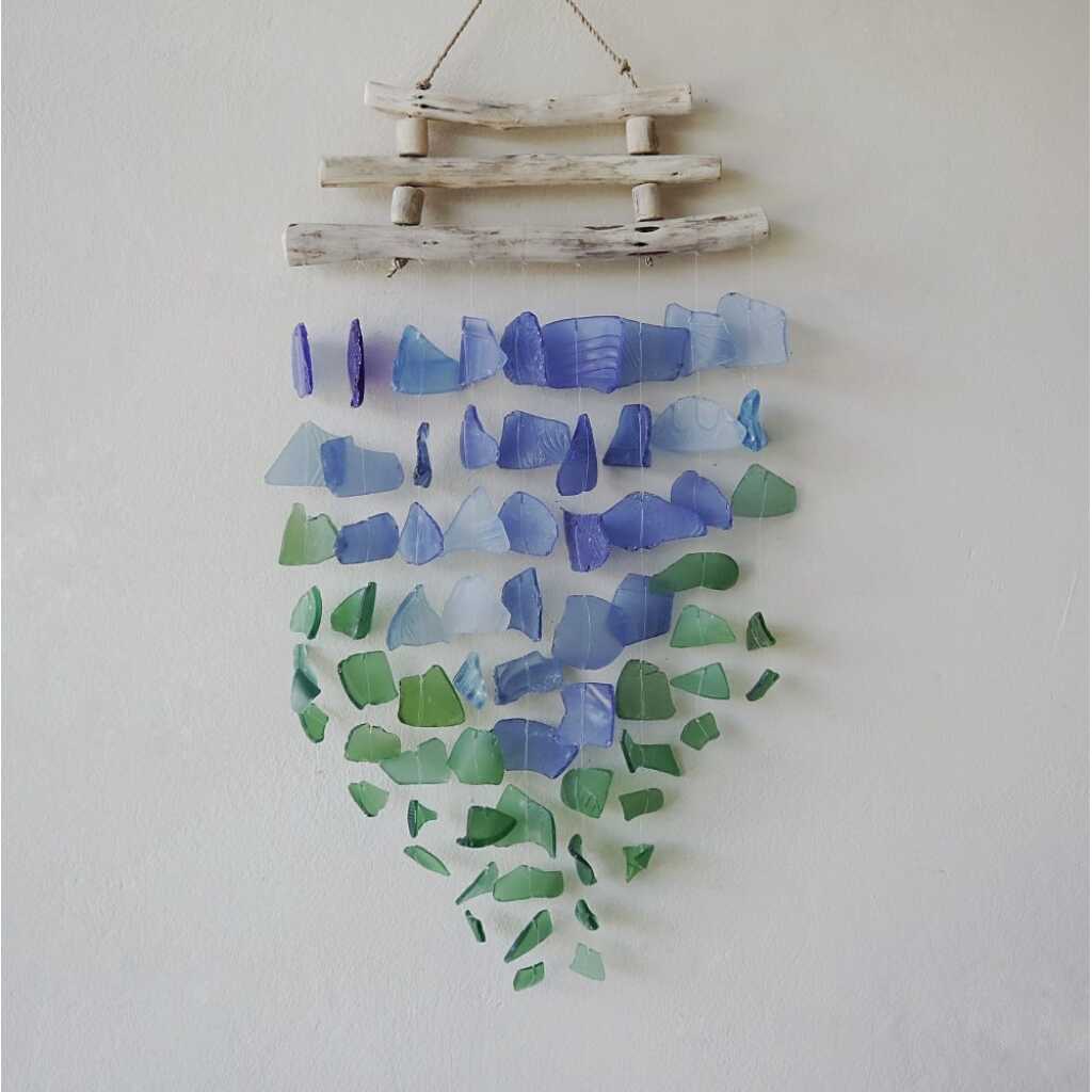 Driftwood and reclaimed glass wind chimes with three driftwood sticks and blue and green glass