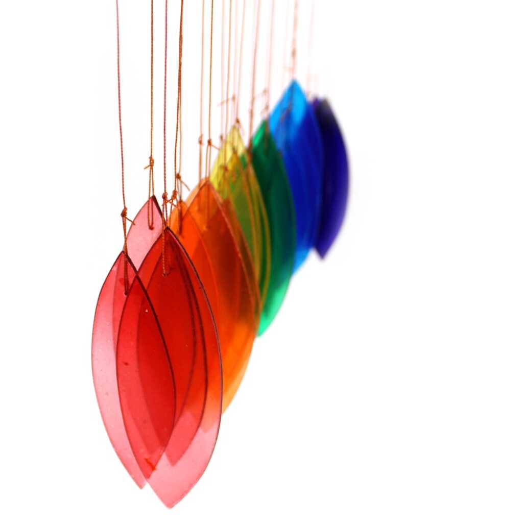 Driftwood and reclaimed glass wind chimes with one driftwood stick and a rainbow selection of coloured glass
