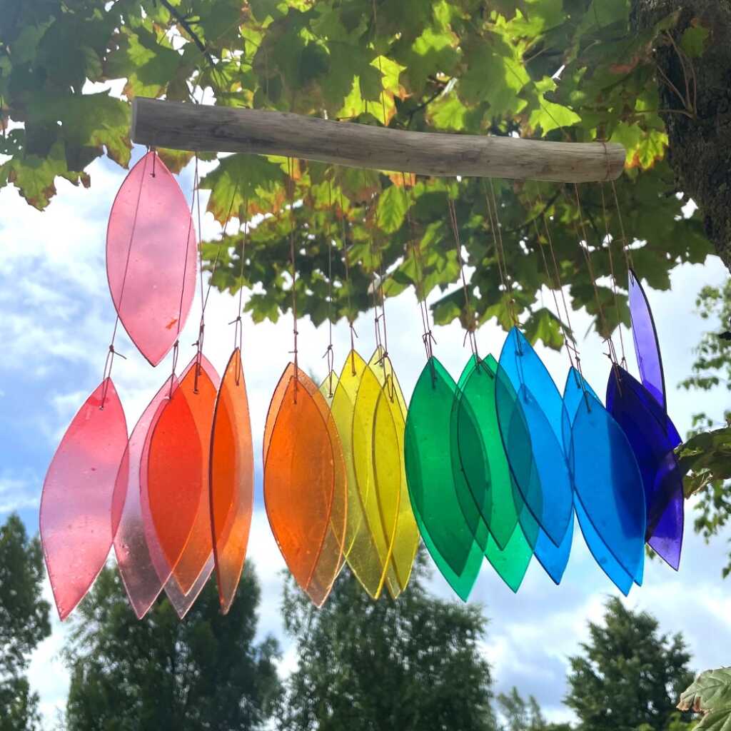 Driftwood and reclaimed glass wind chimes with one driftwood stick and a rainbow selection of coloured glass