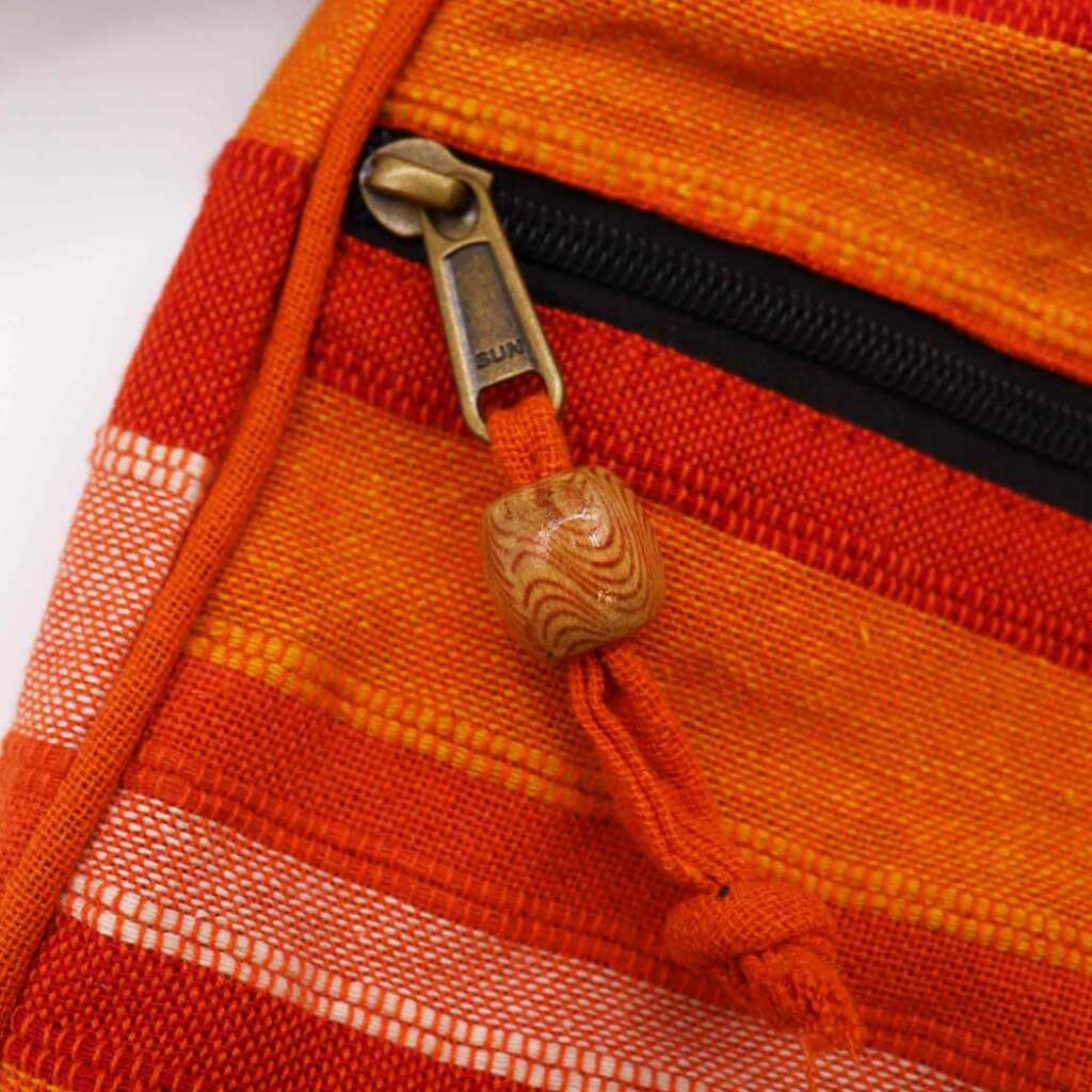 nepal sling bag - sunrise orange with adjustable strap