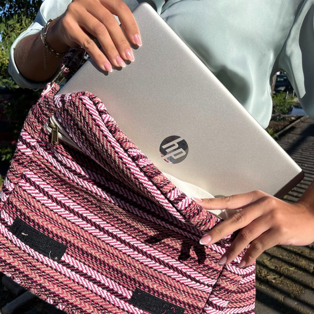 A soft banjar laptop bag in pink, with laptop