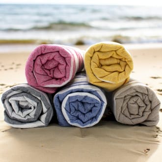 five hammam spa towels all rolled up