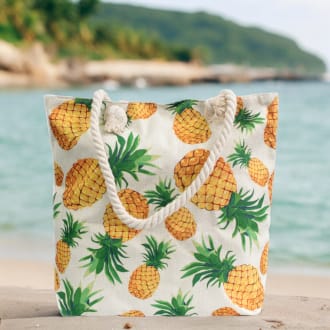 a classic rope handled bag with pineapple motifs