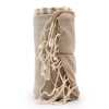 a rolled up, warm sand cotton pareo towel