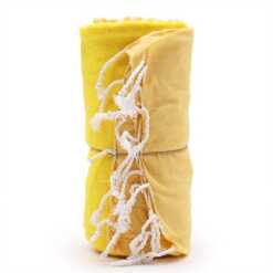 a rolled up, sunny yellow cotton pareo towel