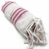 Hammam Spa towel in sunset pink colour, rolled up