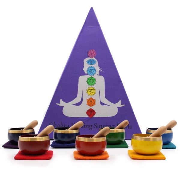 a singing bowl gift set packed in a purple pyramid