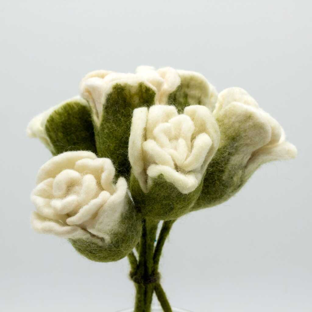 a bunch of white felt roses