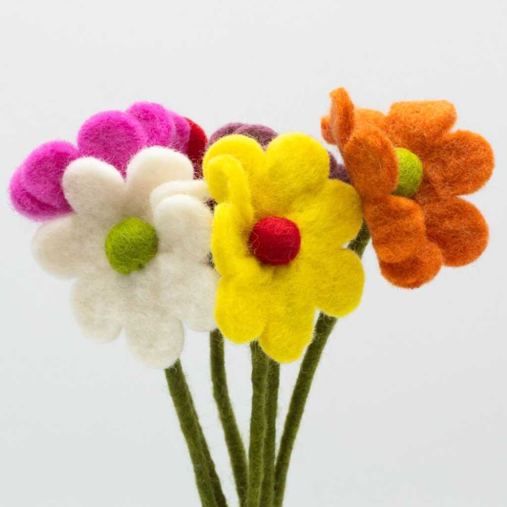 six felt daisies in assorted colours